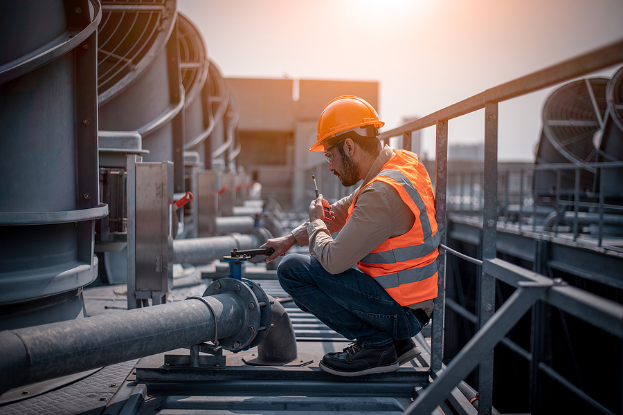 Industry Engineer Under Checking The Industry Cooling Tower Air
